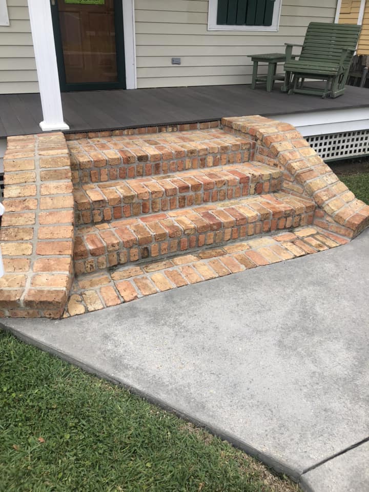 Brick front steps after pressure washing — natural brick restored