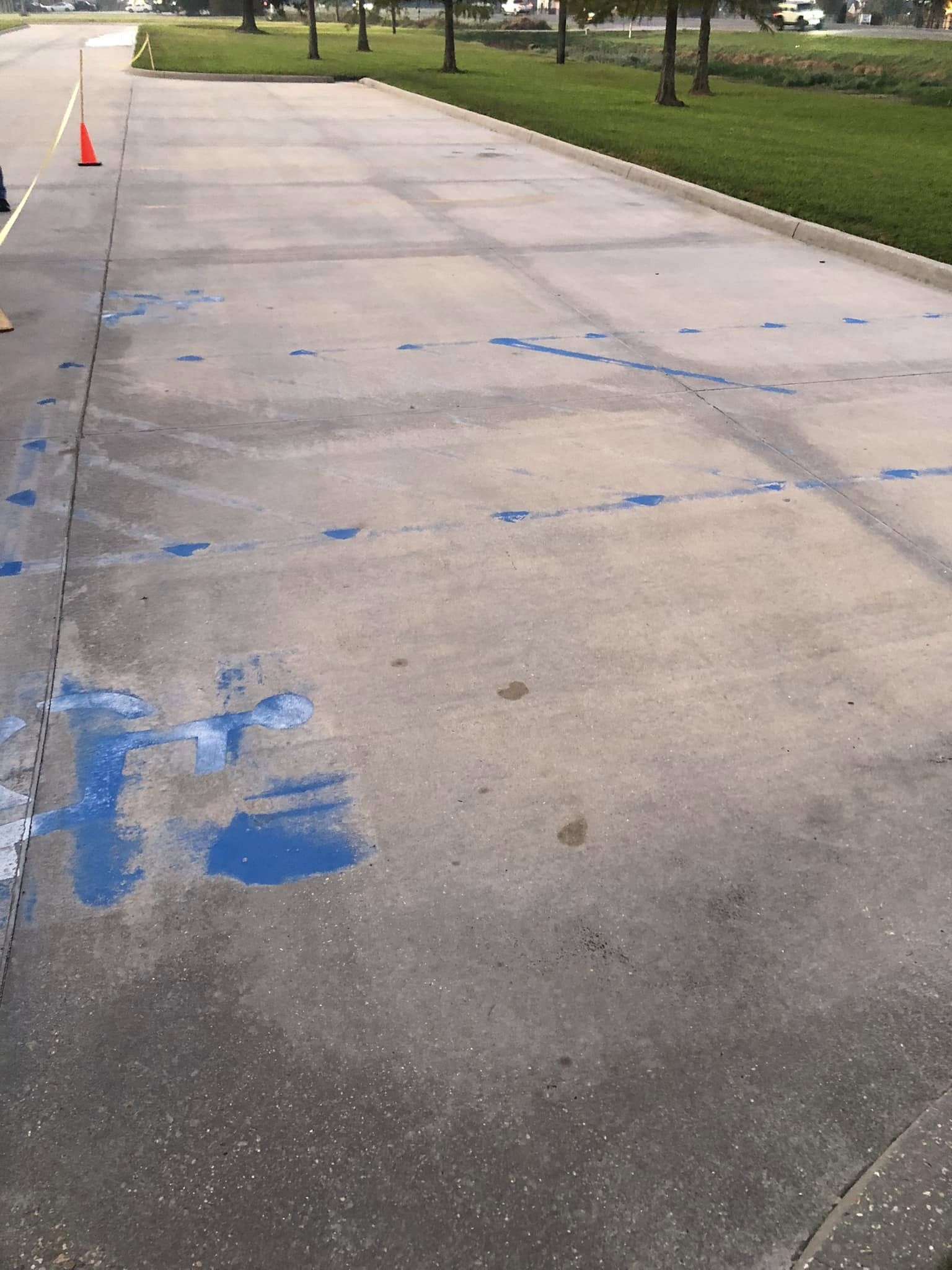 Parking lot before re-striping — faded and messy markings